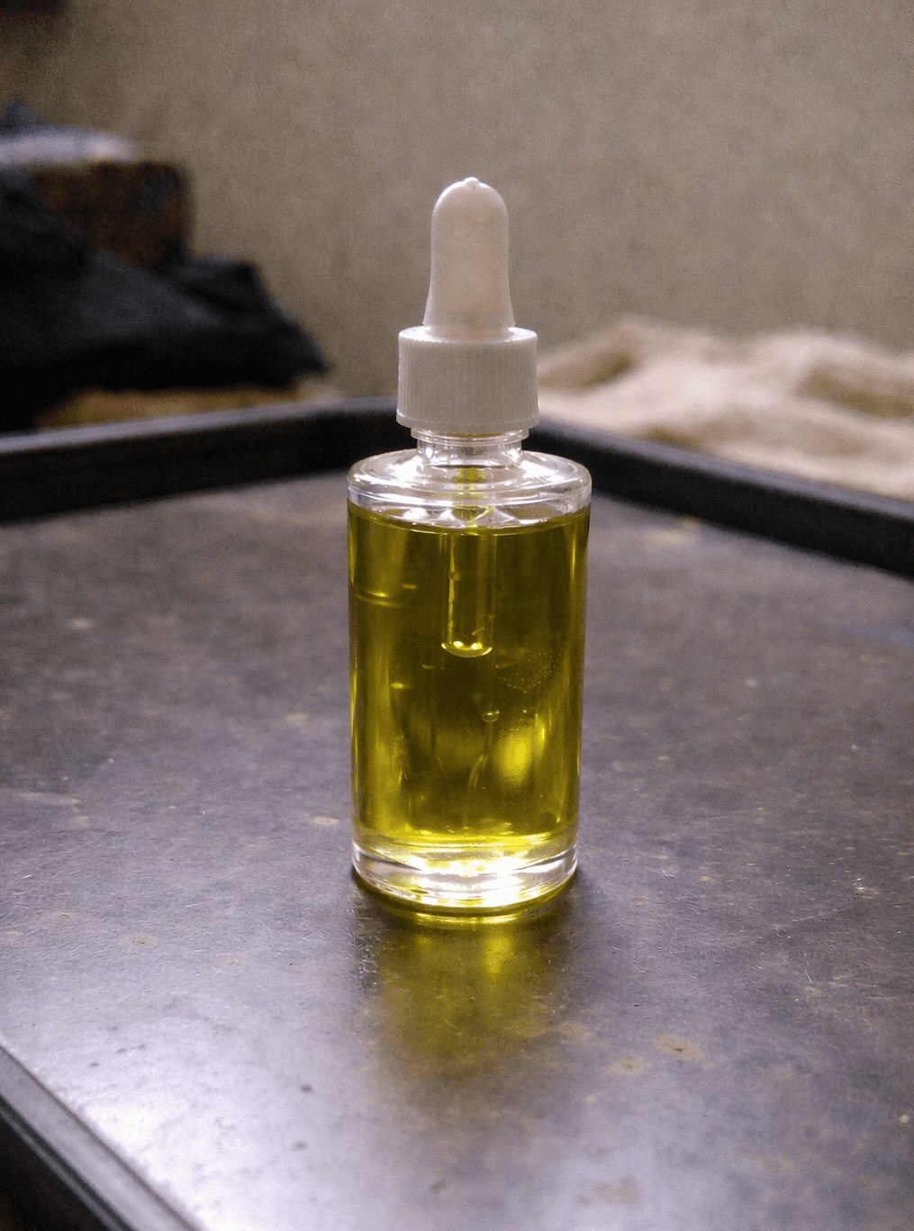 Original amateur product photo of a glass skincare serum bottle before AI enhancement